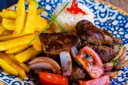 Peruvian Lomo Saltado – Stir-Fried Beef with Tomatoes, Peppers and French Fries